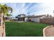 Large backyard with lush grass and a view of the house at 2824 S Bala Dr, Tempe, AZ 85282