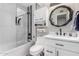 Modern bathroom with a glass shower and white cabinets at 2824 S Bala Dr, Tempe, AZ 85282