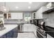 Bright kitchen with white cabinets, farmhouse sink, and granite counters at 2824 S Bala Dr, Tempe, AZ 85282