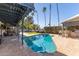 Relaxing kidney-shaped pool with patio and covered seating area at 2824 S Bala Dr, Tempe, AZ 85282