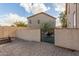 Backyard with block wall, gate, and paved patio at 28396 N Tourmaline Dr, San Tan Valley, AZ 85143