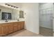 Primary bathroom with double vanity and walk-in closet at 28396 N Tourmaline Dr, San Tan Valley, AZ 85143