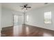 Bright bedroom with hardwood floors, sliding door and ceiling fan at 28396 N Tourmaline Dr, San Tan Valley, AZ 85143