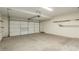 Attached garage with concrete floor and shelving at 28396 N Tourmaline Dr, San Tan Valley, AZ 85143