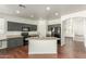 Kitchen with dark cabinets, an island, and stainless steel appliances at 28396 N Tourmaline Dr, San Tan Valley, AZ 85143