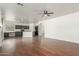 Spacious kitchen with dark cabinets, island, and hardwood floors at 28396 N Tourmaline Dr, San Tan Valley, AZ 85143