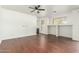 Bright living room with hardwood floors and ceiling fan at 28396 N Tourmaline Dr, San Tan Valley, AZ 85143