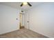 Spacious bedroom with plush carpeting and door to hallway at 3021 W Ocotillo Rd, Phoenix, AZ 85017