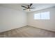 Bright bedroom with ceiling fan and window coverings at 3021 W Ocotillo Rd, Phoenix, AZ 85017