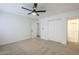 Bright bedroom with ceiling fan and built in closet at 3021 W Ocotillo Rd, Phoenix, AZ 85017