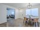 Light and airy dining area with wood table and modern chandelier at 3021 W Ocotillo Rd, Phoenix, AZ 85017