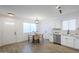 Modern kitchen with white cabinets and stainless steel appliances at 3021 W Ocotillo Rd, Phoenix, AZ 85017