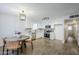 Bright kitchen features white shaker cabinets, stainless steel appliances, and wood-look tile floors at 3021 W Ocotillo Rd, Phoenix, AZ 85017