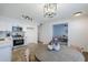 Modern kitchen with island and view into living room at 3021 W Ocotillo Rd, Phoenix, AZ 85017