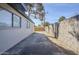 Side yard with concrete pathway and block wall at 3021 W Ocotillo Rd, Phoenix, AZ 85017