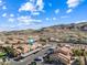 Aerial view of community, showing location of property, pool, and surrounding desert landscape at 3511 E Baseline Rd # 1147, Phoenix, AZ 85042