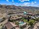 Aerial view showcasing community pool, landscaping, and property location within the complex at 3511 E Baseline Rd # 1147, Phoenix, AZ 85042