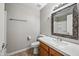 Bathroom with wood vanity and mirrored medicine cabinet at 3511 E Baseline Rd # 1147, Phoenix, AZ 85042