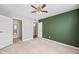 Spacious bedroom with ceiling fan, neutral wall paint, and carpet at 3511 E Baseline Rd # 1147, Phoenix, AZ 85042