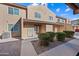 Tan stucco building with double doors and landscaping at 3511 E Baseline Rd # 1147, Phoenix, AZ 85042