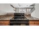 Modern electric cooktop with granite countertop at 3511 E Baseline Rd # 1147, Phoenix, AZ 85042