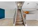 Modern staircase with wood-look laminate treads and metal railing at 3511 E Baseline Rd # 1147, Phoenix, AZ 85042