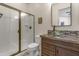 Bathroom with walk-in shower, glass enclosure, vessel sink, granite vanity at 3560 E Ironside Ln, Gilbert, AZ 85298