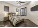 Comfortable bedroom with wood flooring and a neutral color palette at 3560 E Ironside Ln, Gilbert, AZ 85298