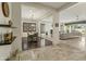 Open concept dining area with hardwood floors and adjacent living space at 3560 E Ironside Ln, Gilbert, AZ 85298