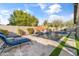 Resort-style backyard with pool, lounge chairs, and stone patio at 3560 E Ironside Ln, Gilbert, AZ 85298