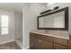 Bathroom boasts a large vanity mirror and updated shower at 401 N 68Th Ave # 247, Phoenix, AZ 85043