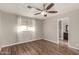 Bright bedroom with hardwood floors and access to bathroom at 401 N 68Th Ave # 247, Phoenix, AZ 85043