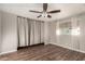 Spacious bedroom with hardwood floors and ceiling fan at 401 N 68Th Ave # 247, Phoenix, AZ 85043