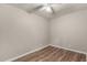 Bright bedroom features wood-look flooring and ceiling fan at 401 N 68Th Ave # 247, Phoenix, AZ 85043