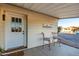 Front entry of the home with a welcome sign and seating at 401 N 68Th Ave # 247, Phoenix, AZ 85043