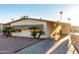 Side view of a single-story manufactured home with a covered carport at 401 N 68Th Ave # 247, Phoenix, AZ 85043