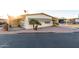 Front view of a single-story manufactured home with a covered patio at 401 N 68Th Ave # 247, Phoenix, AZ 85043