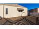 Rear view of manufactured home with gravel and fence at 401 N 68Th Ave # 247, Phoenix, AZ 85043