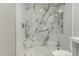 Large walk-in shower with marble tile and glass enclosure at 401 N 68Th Ave # 247, Phoenix, AZ 85043