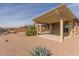 Landscaped backyard with covered patio and pergola at 40861 W Little Dr, Maricopa, AZ 85138