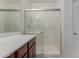 Clean bathroom with a walk-in shower and modern vanity at 40861 W Little Dr, Maricopa, AZ 85138