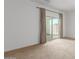 Bedroom with sliding glass door leading to a patio at 40861 W Little Dr, Maricopa, AZ 85138