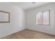 Bright bedroom with neutral walls and carpeting at 40861 W Little Dr, Maricopa, AZ 85138