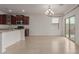 Dining area with tile flooring and sliding door to backyard at 40861 W Little Dr, Maricopa, AZ 85138