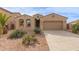 One-story house with desert landscaping, two-car garage, and neutral color palette at 40861 W Little Dr, Maricopa, AZ 85138