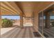 Covered patio with sliding glass door access at 40861 W Little Dr, Maricopa, AZ 85138