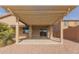 Covered patio with pergola and backyard access at 40861 W Little Dr, Maricopa, AZ 85138