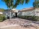 Front view of house showing landscaping, walkway, and entryway at 4142 E Sahuaro Dr, Phoenix, AZ 85028