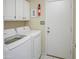 Bright laundry room, featuring washer, dryer, and ample storage at 4142 E Sahuaro Dr, Phoenix, AZ 85028