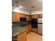 Spacious kitchen with granite countertops and wood cabinets at 4200 N Miller Rd # 112, Scottsdale, AZ 85251